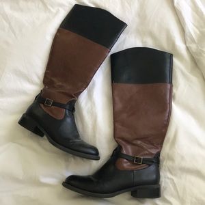 Brown leather riding boots.